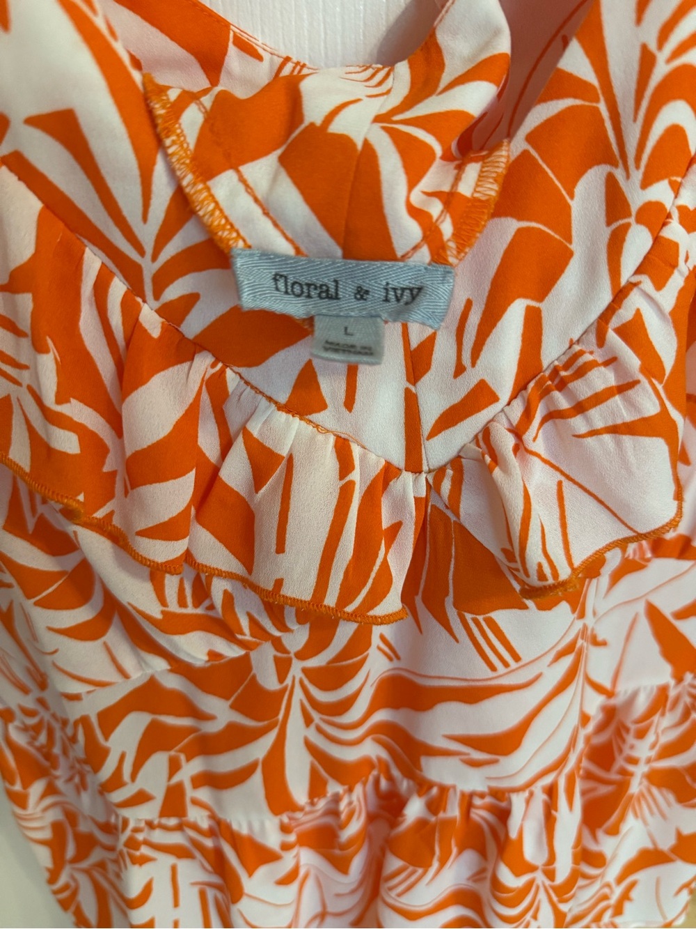 Floral & Ivy Orange & White Ruffle Front Casual Women's Top